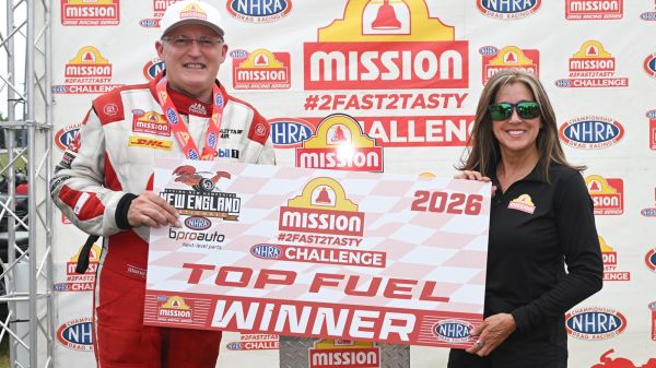 Doug Kalitta with the Mission #2Fast2Tasty Challenge trophy at the NHRA New England Nationals.